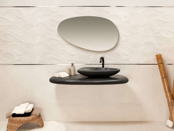 Bathroom with all organic rounded shapes, from the vanity to the sink to the mirror.
