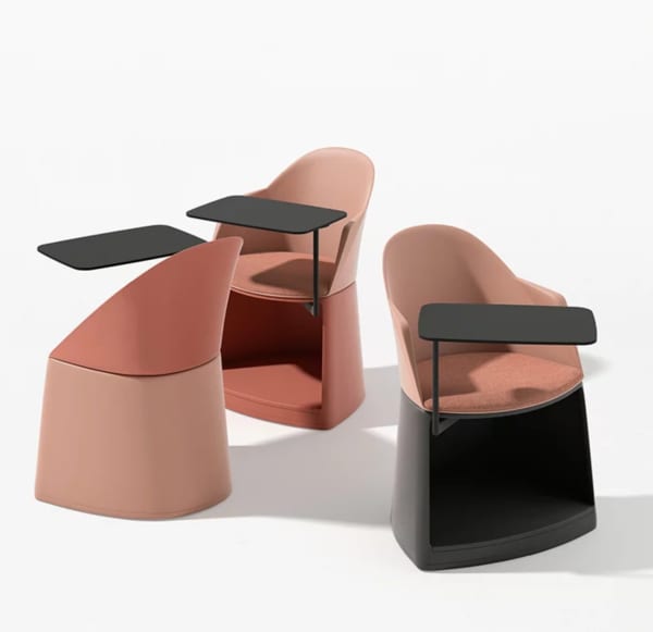 Chair with small integrated table and a storage unit at the bottom.
