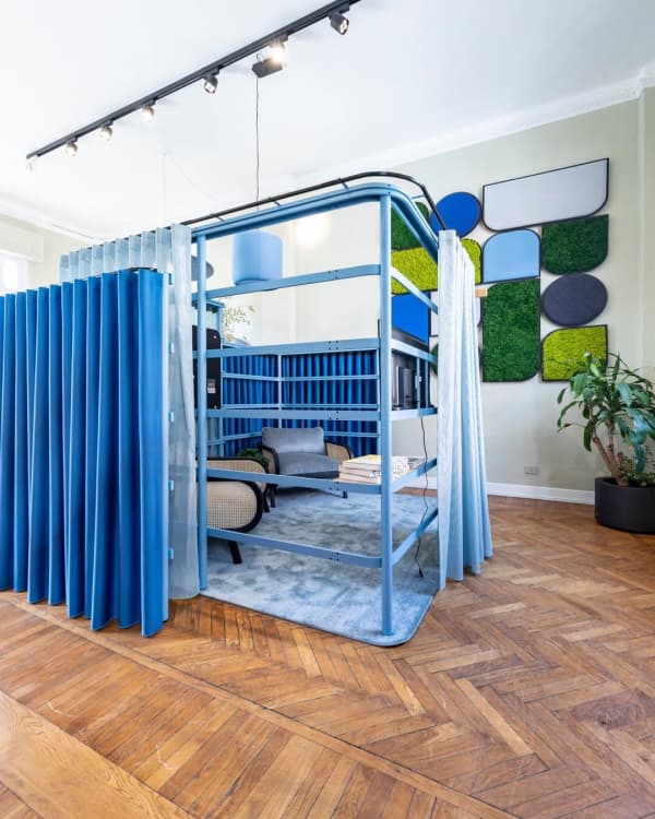 Small conversation areas enclosed with curtains.