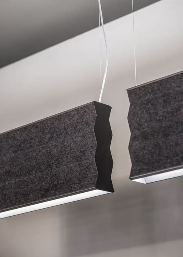 Pendant light whose shade is made with sound-absorbing felt panel.