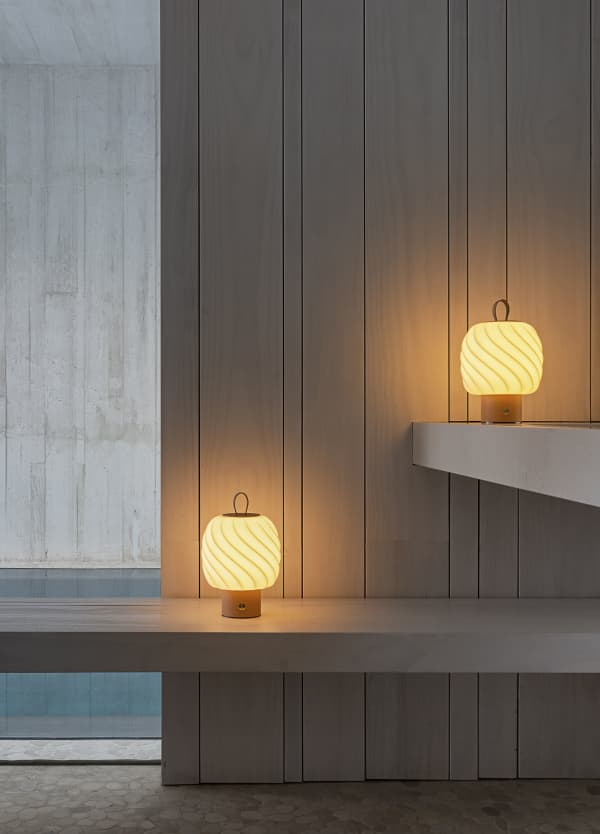 Portable table lamps with porcelain shade shaped in the form of a fluffy ice cream.