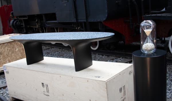 Hourglass and bench made recycling plastic.