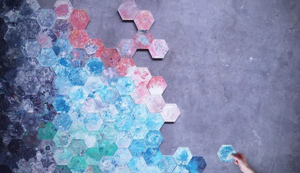 A wall of hexagonal recycled plastic tiles.