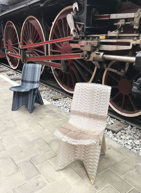 Recycled plastic chairs; clear and black.
