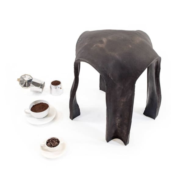 Circular stool made out of coffee grounds.