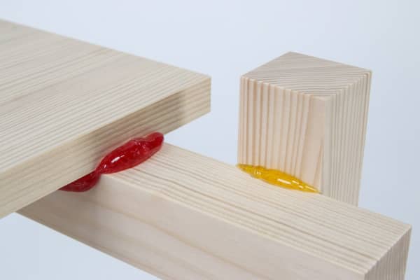 Close up of the wooden pieces kept together with a candy-based glue.