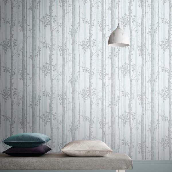 Grey wallpaper reproducing intricate branches and leaves as an example of the use of natural fractals in interiors.