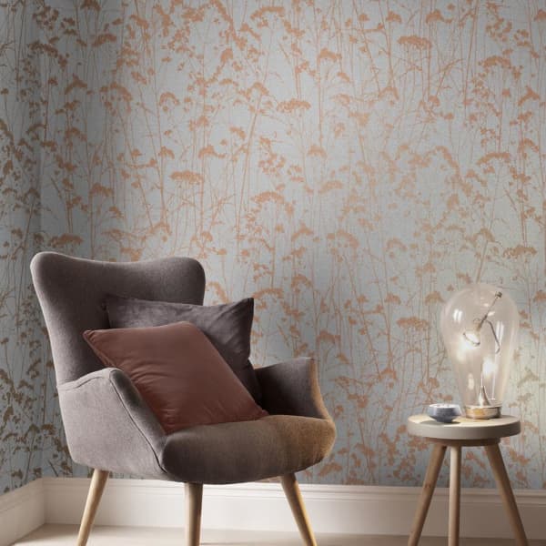 Grey wallpaper with brown branches.