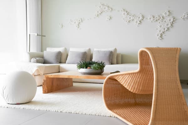 Living room with a 3D artwork on the wall that recalls natural fractals.