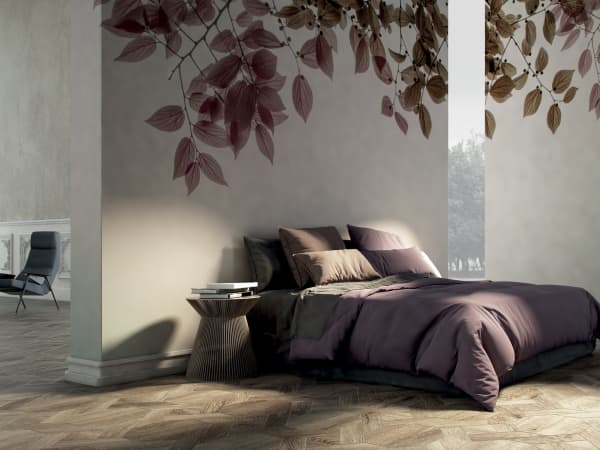Bedroom with a wallpaper reproducing the natural fractal of branches with leaves, that drape from the top.