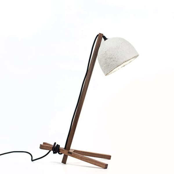 A table lamp with wood structure and mycelium base shade.