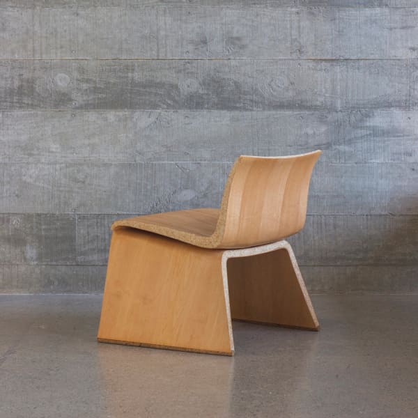 Organic shape chair that looks like a regular bent-wood chair but it's actually an example of biofabriction.