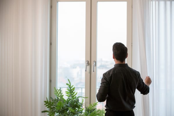 IKEA GUNRID white curtains on a large window.