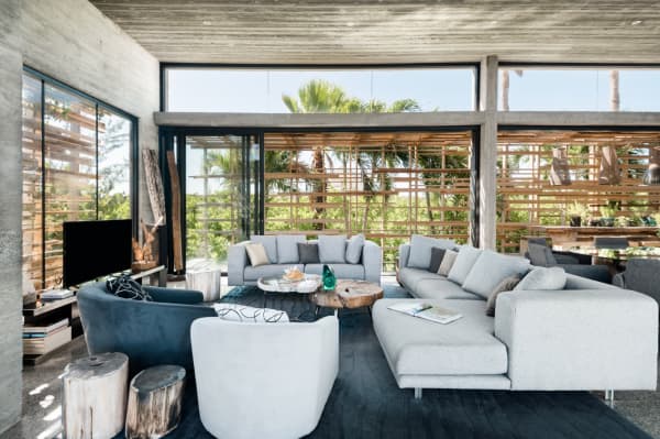 The open living area of Villa Islander, which huge windows on all sides.