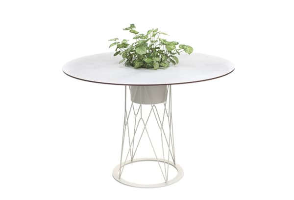 Outdoor round table with integrated planter in the center.