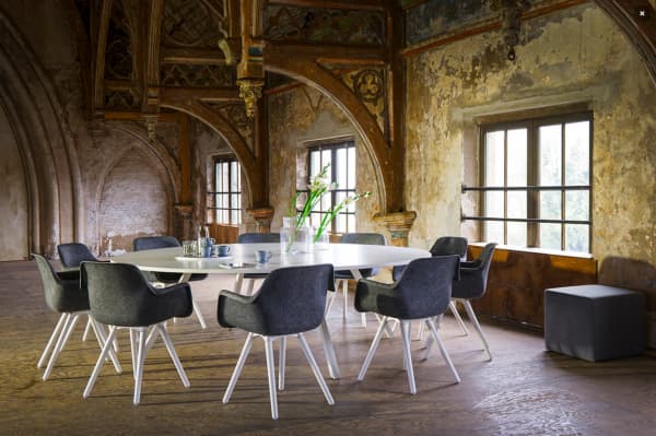 Round table with chairs designed with circular principles in mind.