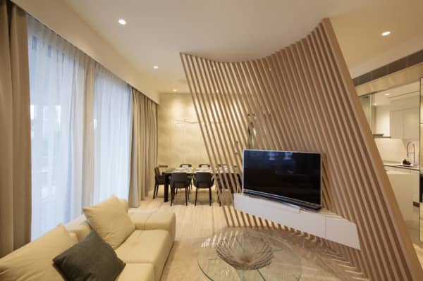 TV corner shielded from the rest of the room with slanted wooden panels.