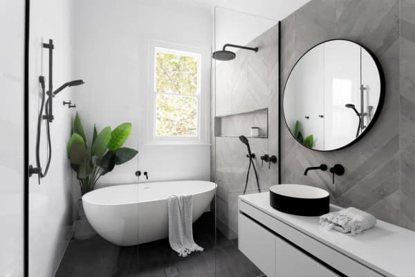 Bathtub at the very end on a narrow bathroom creates a refuge corner.