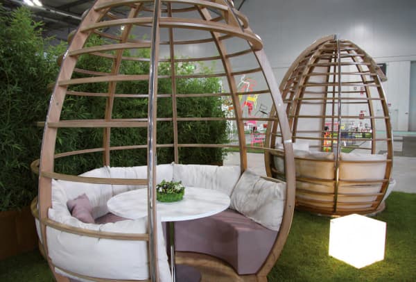 Egg-shaped structure shielding a seating area.