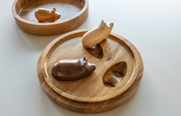 Jigsaw toy with wooden pigs.