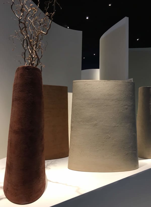 Close-up of the textural planters and tall trees.
