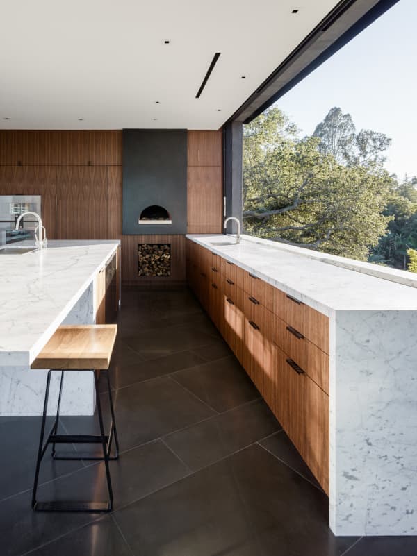 Kitchen with a huge window instead of a backsplash.