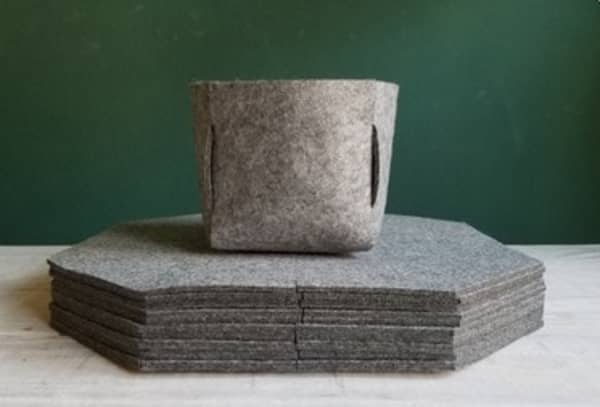 Shot showing a pile of disassembled Bobby felt planters which shows they lay flat.