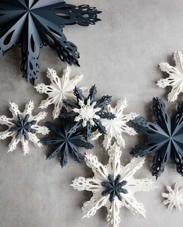 Flatlay of blue and white paper stars.