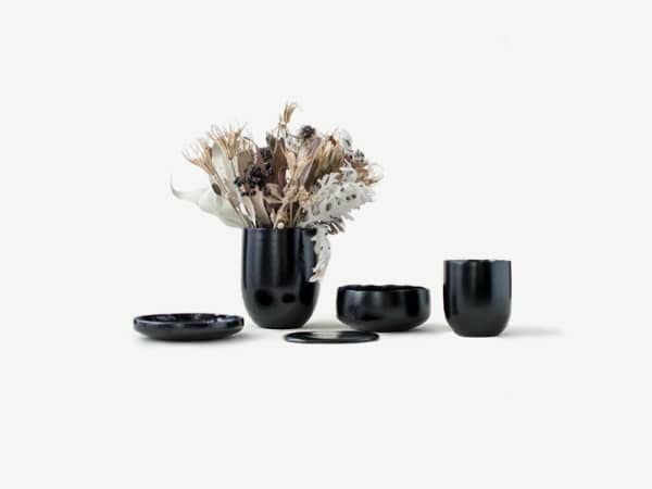 Black tableware made of food waste.