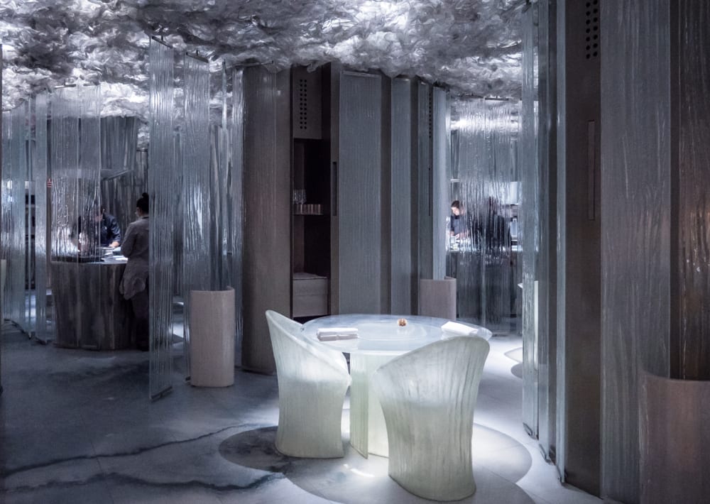Restaurant with etched glass partitions looking like flowing water.<span class="sr-only"> (opened in a new window/tab)</span>