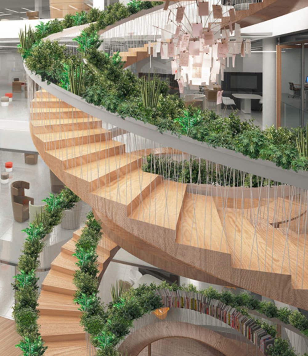 A circular staircase with plants all along the handrail.<span class="sr-only"> (opened in a new window/tab)</span>