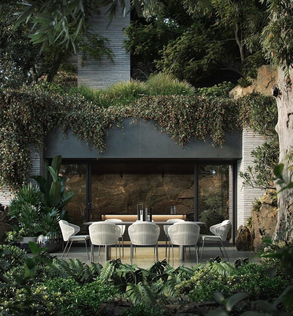Outdoor dining area totally surrounded by greenery.<span class="sr-only"> (opened in a new window/tab)</span>