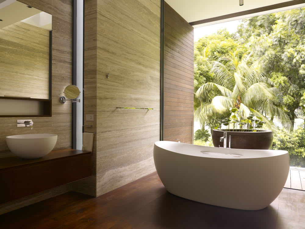 Natural bathroom design with a floor-to-ceiling window looking into the forest.<span class="sr-only"> (opened in a new window/tab)</span>