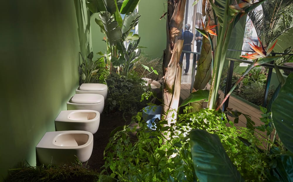 Toilets surrounded by greenery in a jungle-like environment.<span class="sr-only"> (opened in a new window/tab)</span>