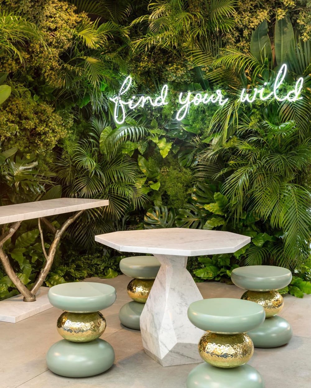Close-up of the booth's back wall that is entirely covered in greenery.<span class="sr-only"> (opened in a new window/tab)</span>