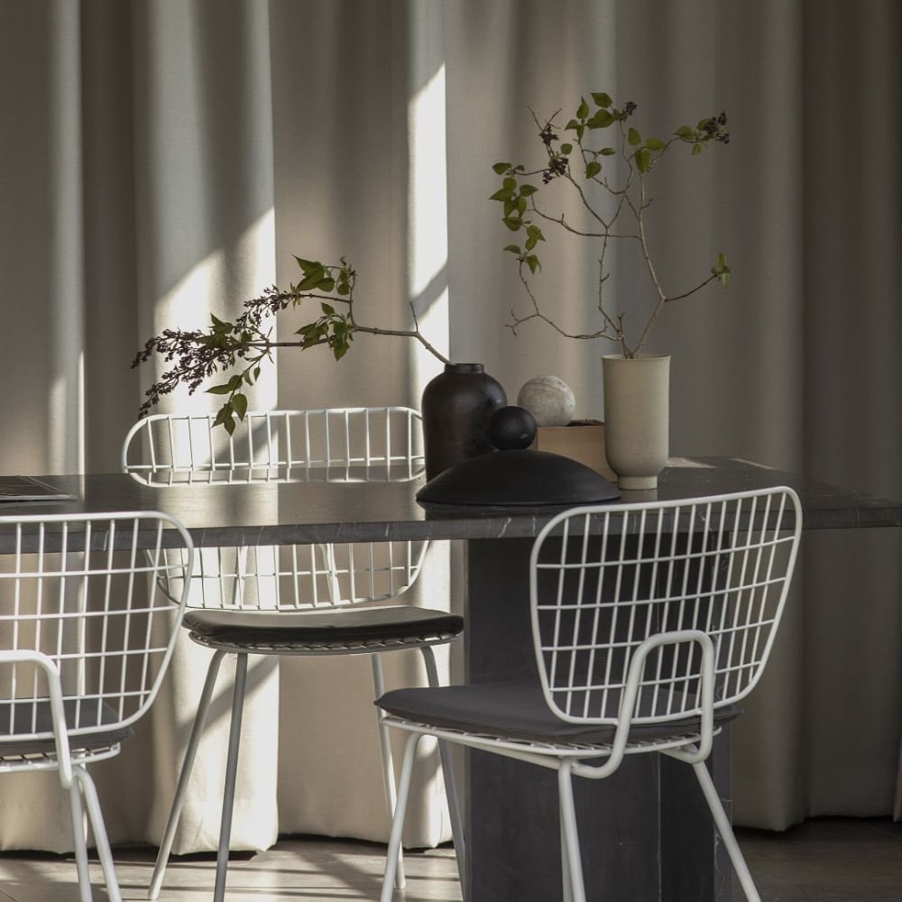 View of a table with natural light filtering from outside.<span class="sr-only"> (opened in a new window/tab)</span>