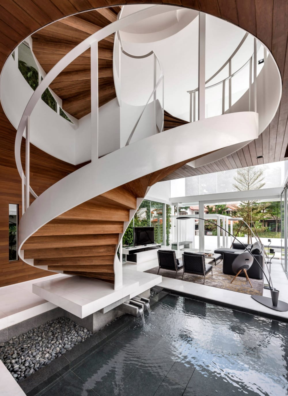 Pond below a modern staircase.<span class="sr-only"> (opened in a new window/tab)</span>