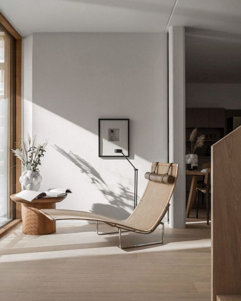 A reading corner furnished with a sculptural chiase longue in front of a big window.<span class="sr-only"> (opened in a new window/tab)</span>