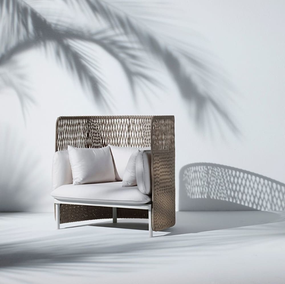 High back white outdoor sofa with a woven back.<span class="sr-only"> (opened in a new window/tab)</span>