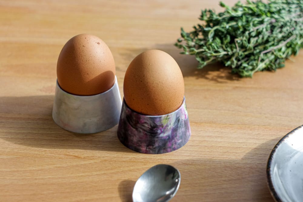 Recycled plastic egg cups on a table.<span class="sr-only"> (opened in a new window/tab)</span>