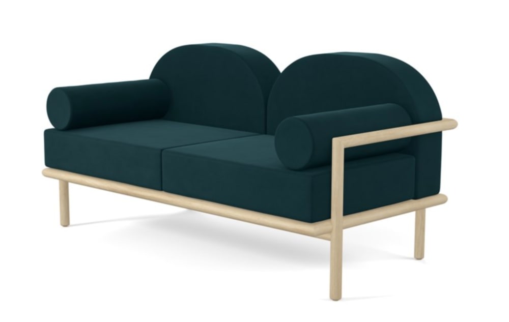 Sculptural sofa with curved back and cushions.<span class="sr-only"> (opened in a new window/tab)</span>