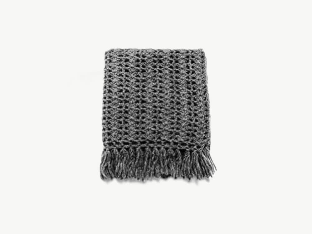 Dark grey crocheted blanket.<span class="sr-only"> (opened in a new window/tab)</span>