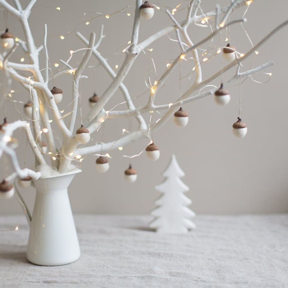 Branch decorated with acorns with a felt body mounted on real tops.<span class="sr-only"> (opened in a new window/tab)</span>