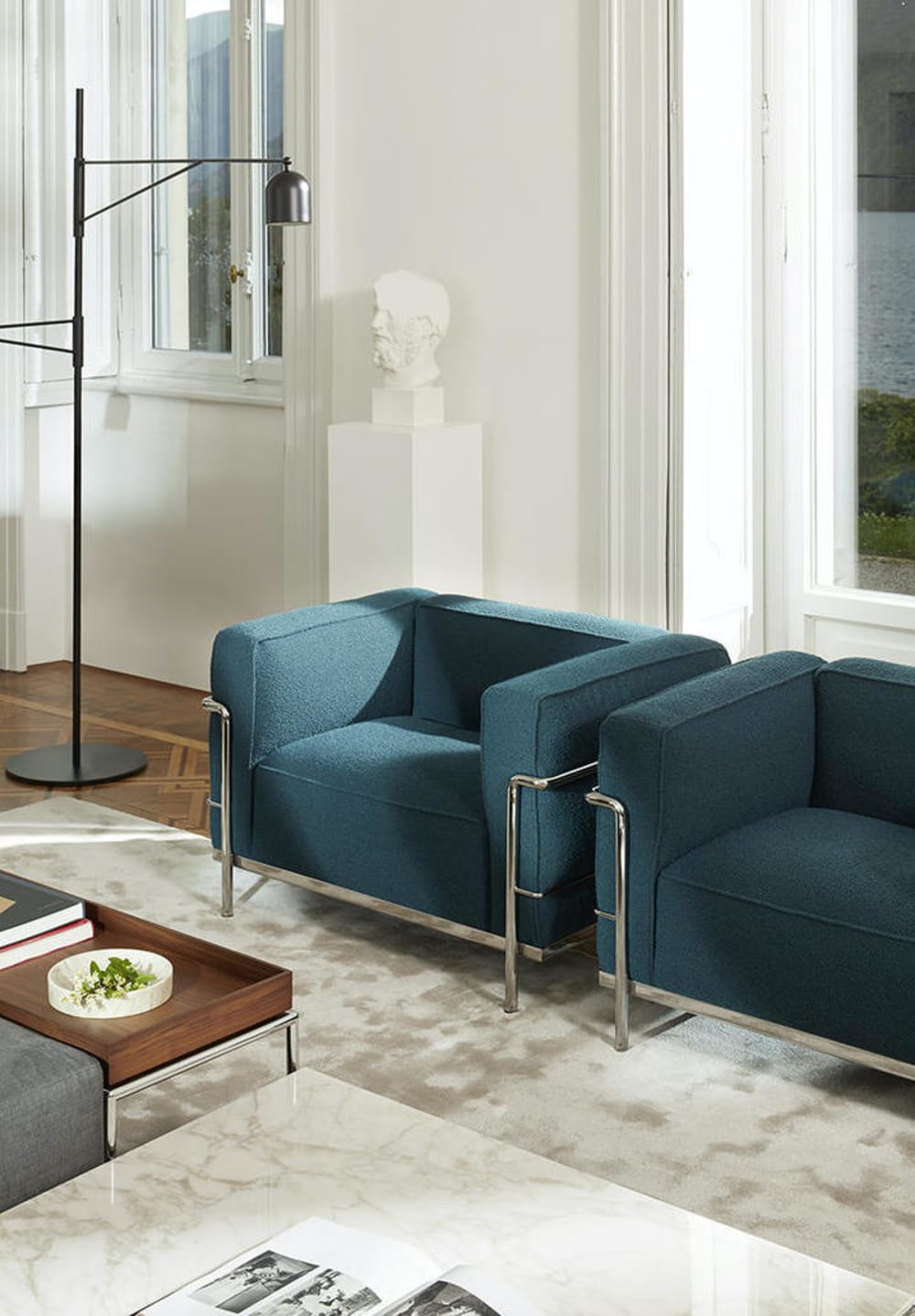 Peacock blue armchair in a modern living room.<span class="sr-only"> (opened in a new window/tab)</span>