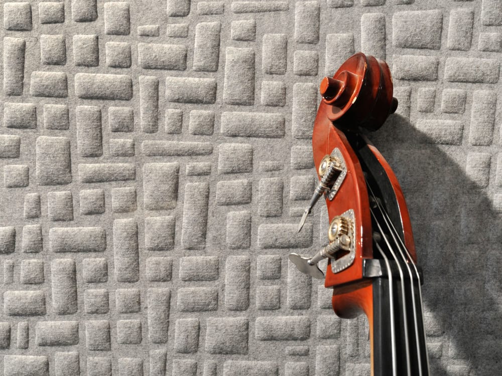 Close-up of a wool acoustic panel with a geometric pattern.<span class="sr-only"> (opened in a new window/tab)</span>