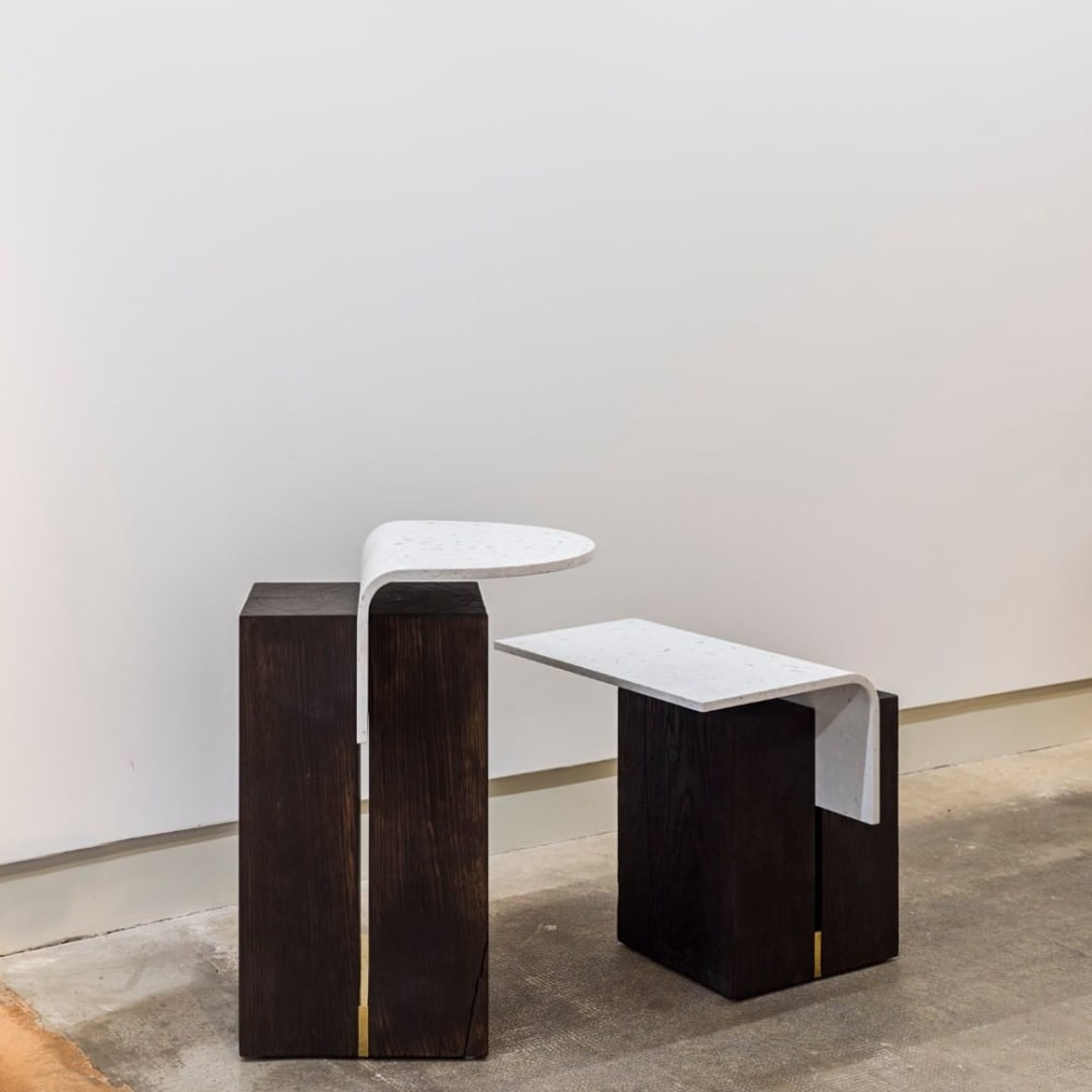 Minimal sustainable coffee tables with curved white top and dark chunky base.<span class="sr-only"> (opened in a new window/tab)</span>