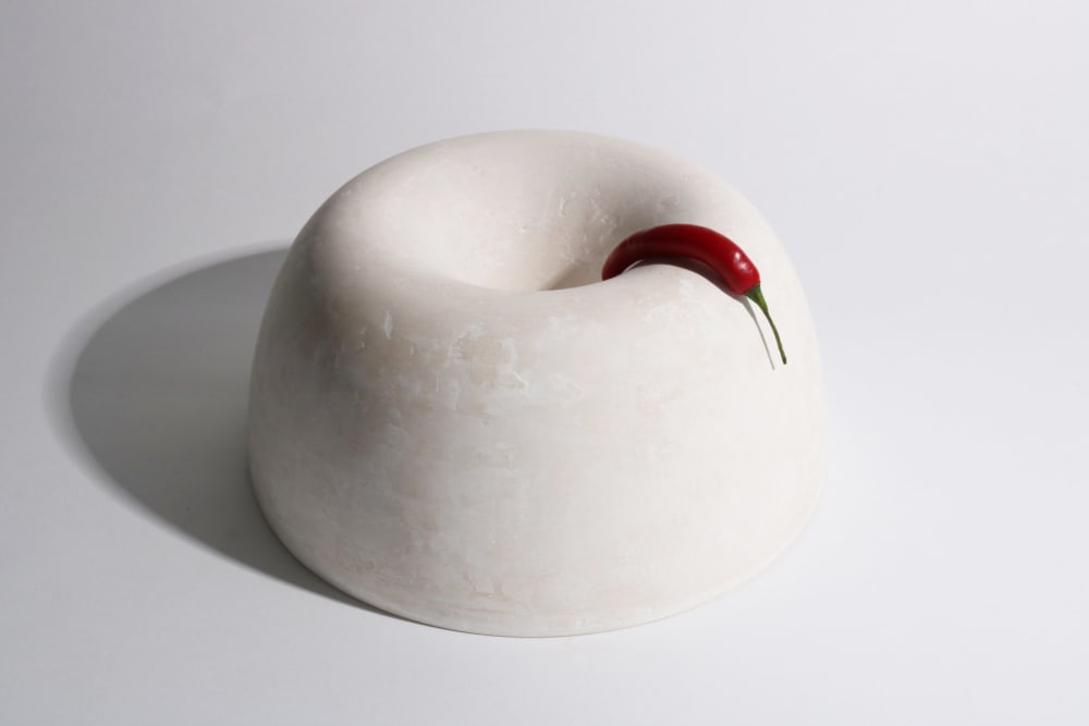 White bowl with a red pepper hanging onto it.<span class="sr-only"> (opened in a new window/tab)</span>