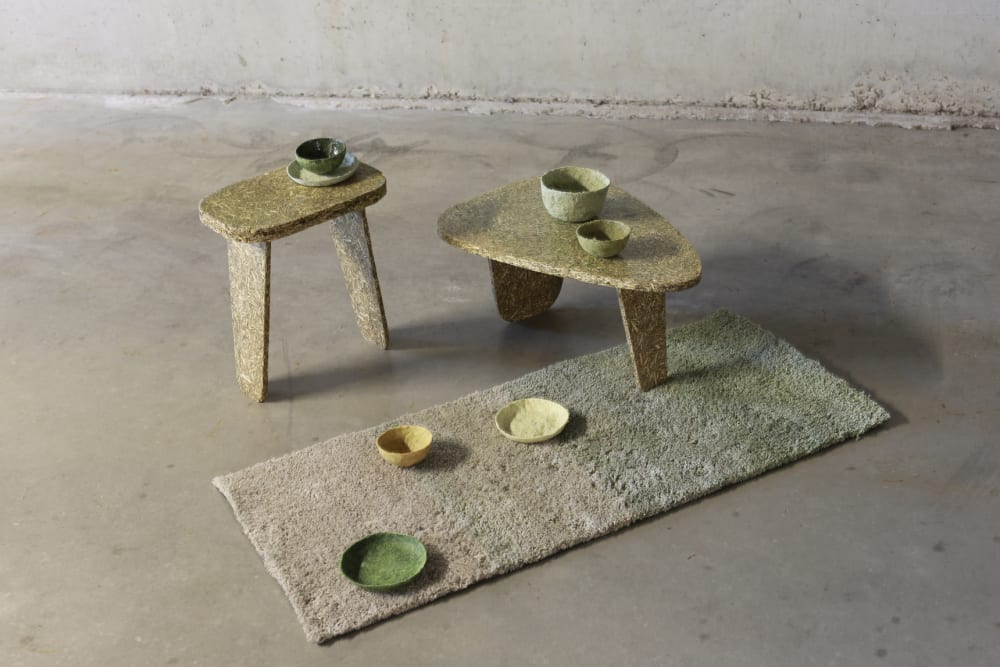 Collection of low tables, bowls and rug made with stinging nettle.<span class="sr-only"> (opened in a new window/tab)</span>