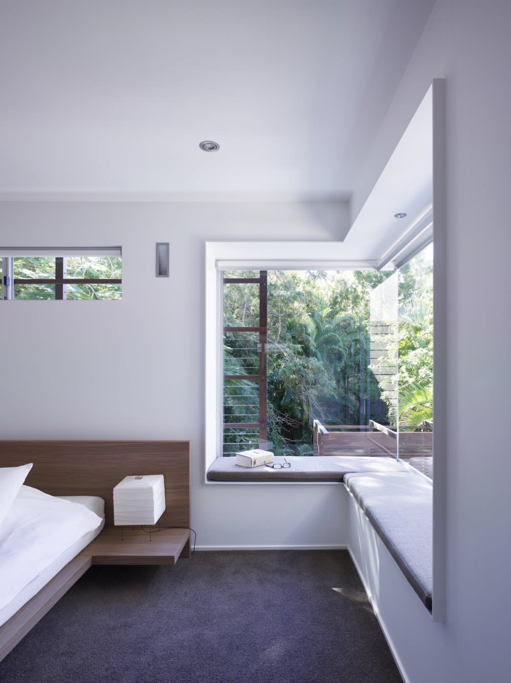 Window seat in a modern bedroom, great option to create a refuge area in a biophilic design.<span class="sr-only"> (opened in a new window/tab)</span>