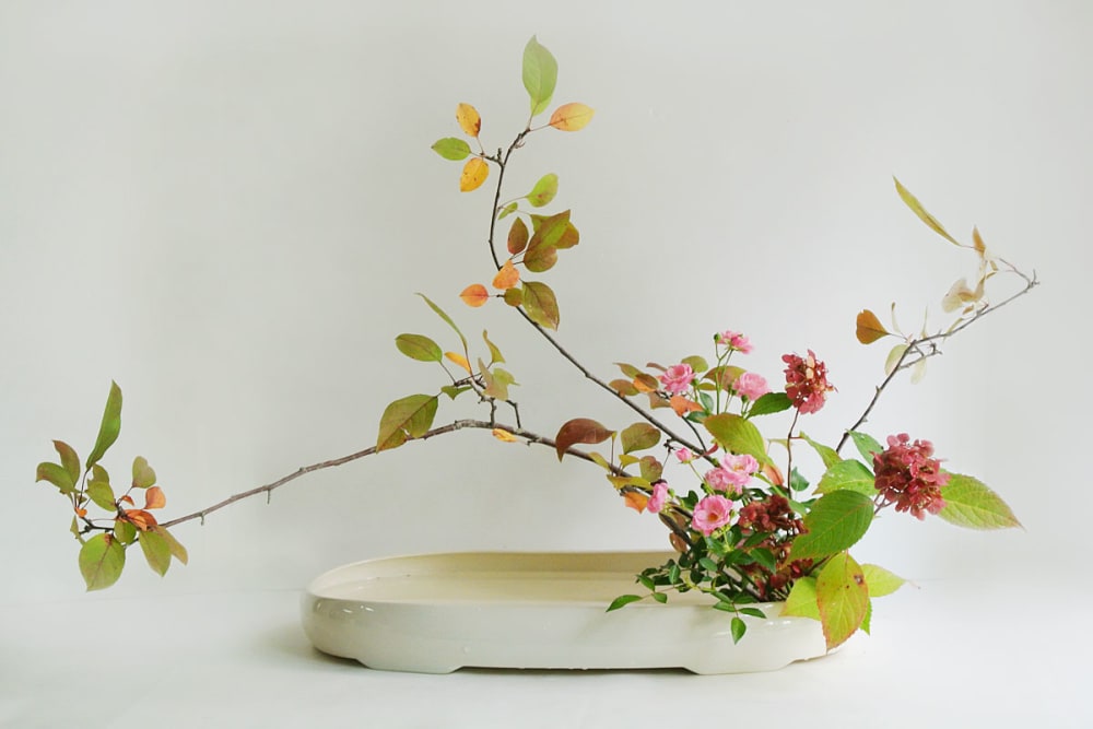 Ikebana arrangement made of local leaves and flowers.<span class="sr-only"> (opened in a new window/tab)</span>